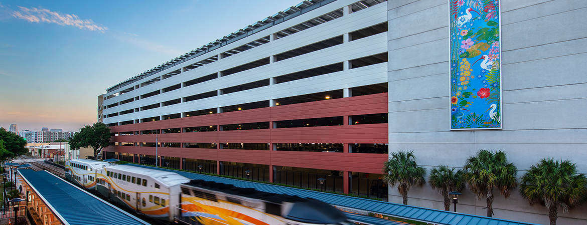 McRae Ave Garage with Sunrail Passing By