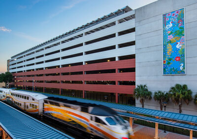 McRae Ave Parking Garage with Sunrail Passing By