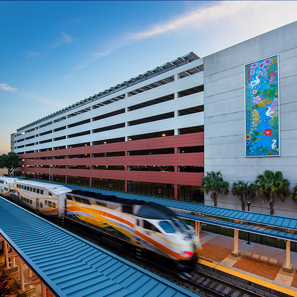 McRae Ave Garage with Sunrail Passing By