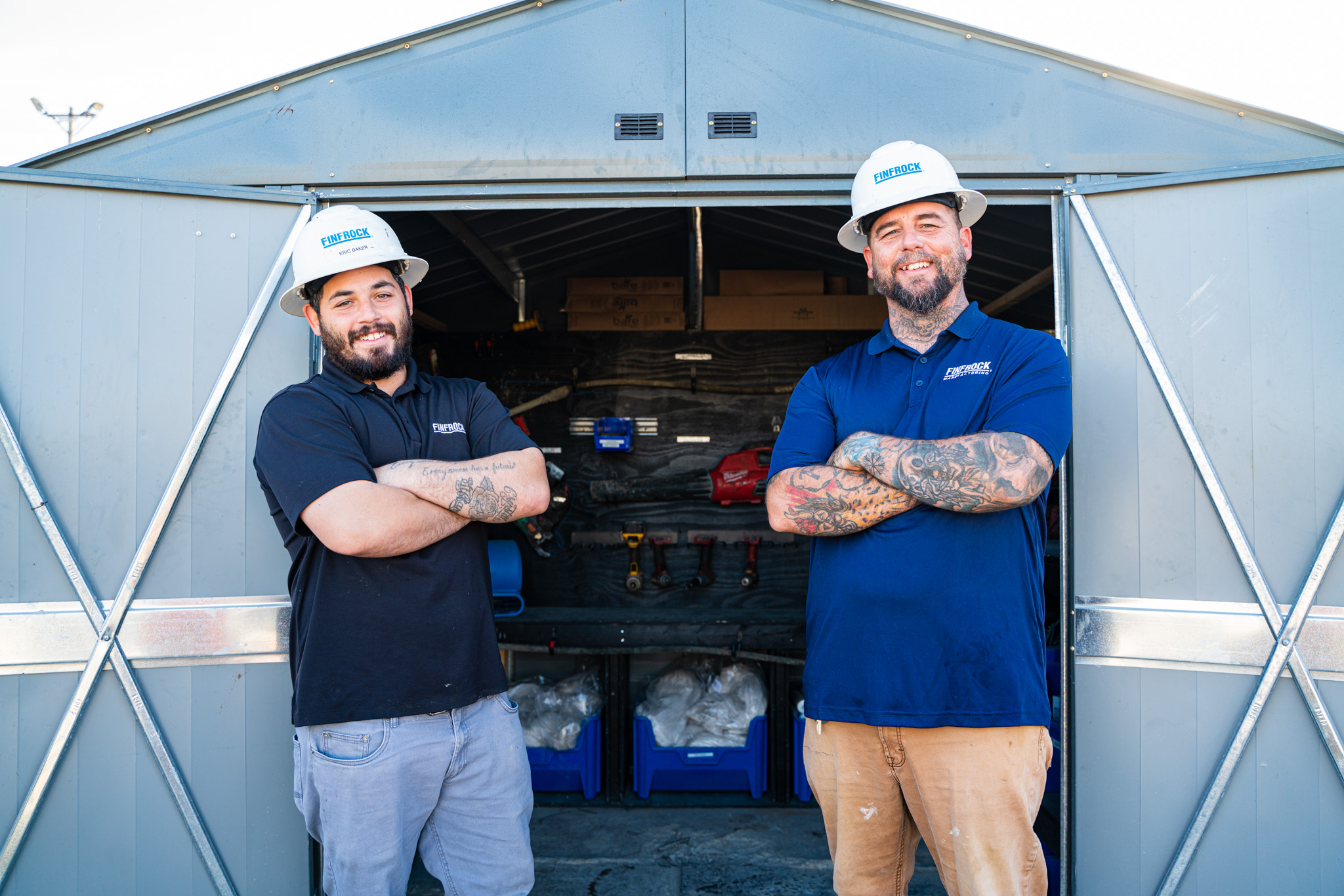 clayton and eric standing in front of their lean manufacturing project