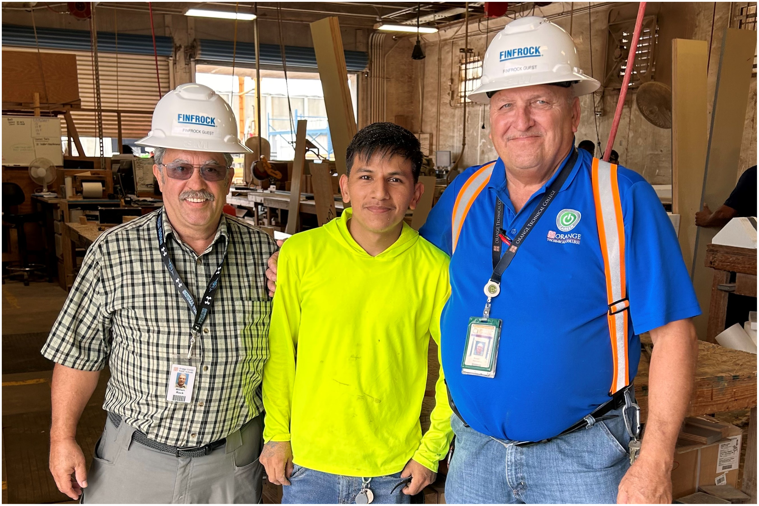 Youth program chaperones pose with FINFROCK carpentry apprentice